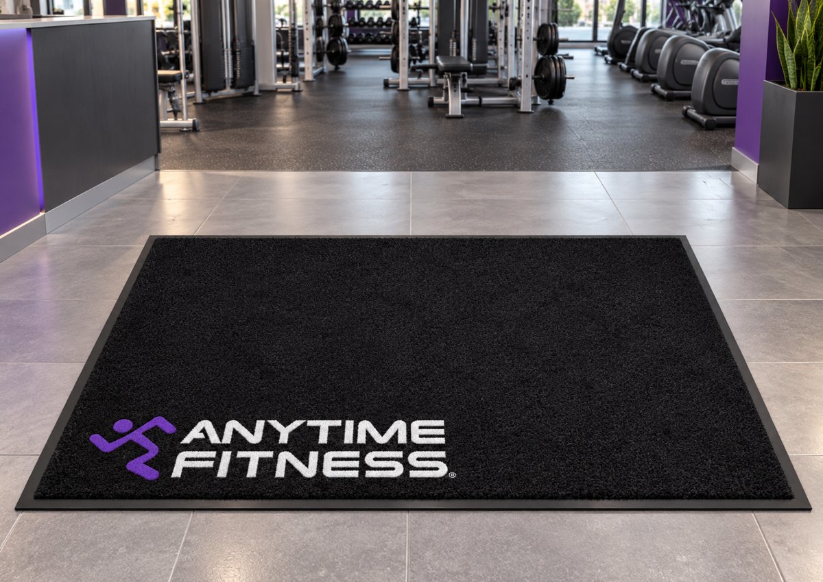 Black logo mat with the Anytime Fitness logo in the corner