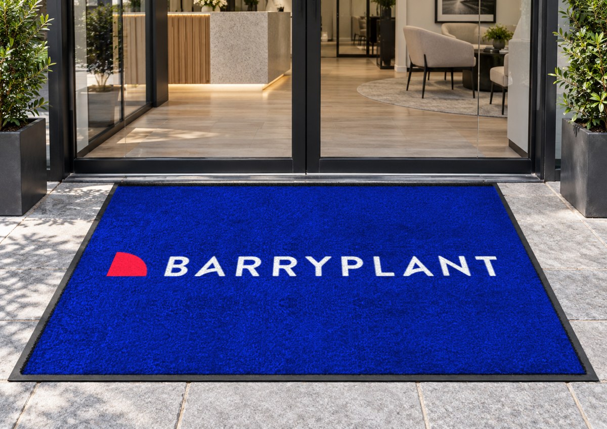 Royal blue logo mat with a large Barry Plant logo
