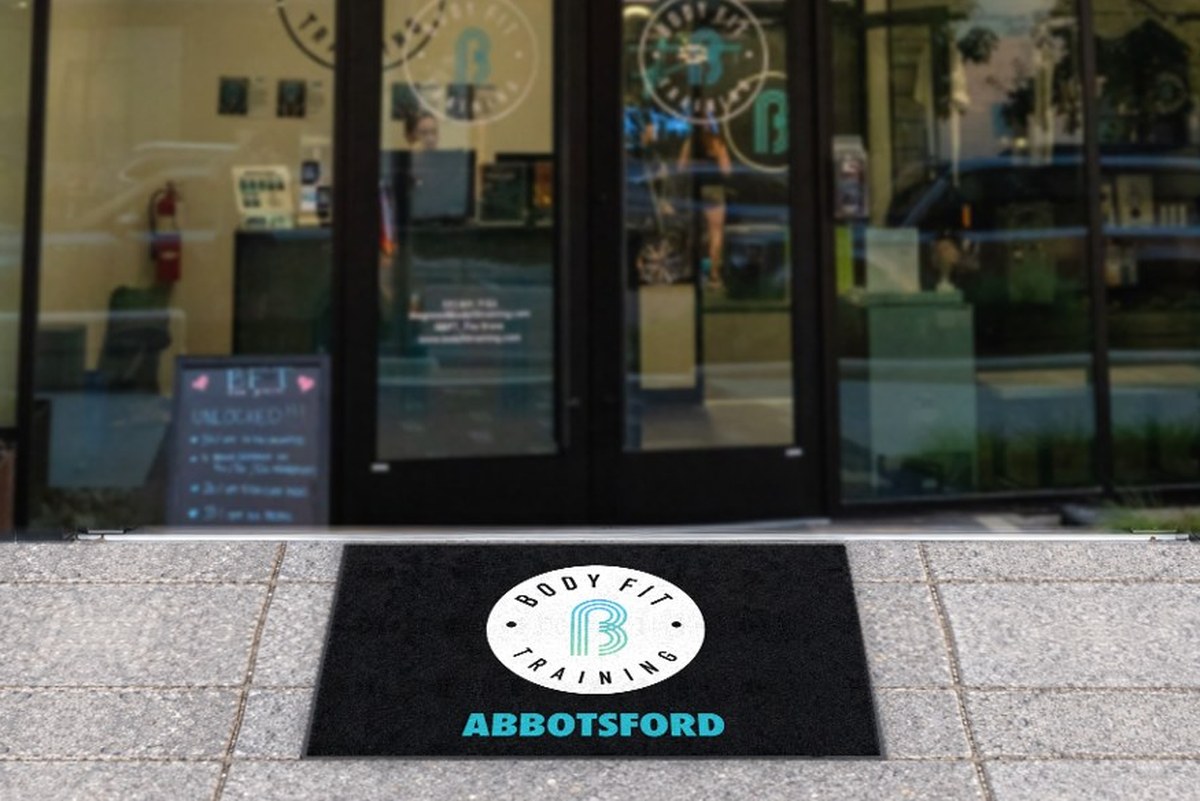 Black logo mat with the Body Fit Training roundel and studio name