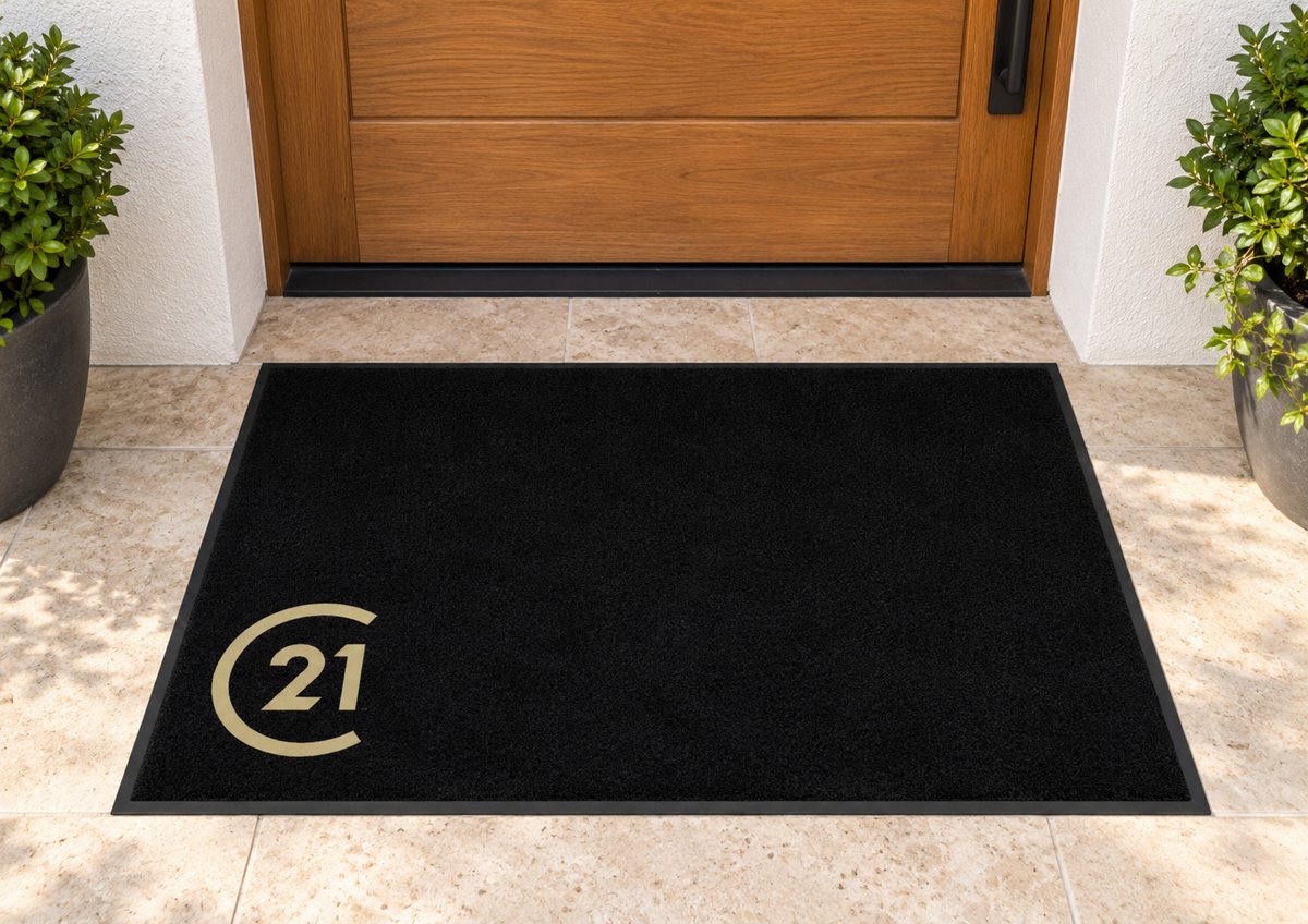 Black logo mat with the gold Century 21 logo in the corner