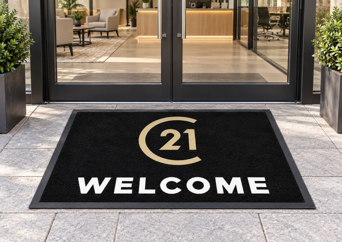 Century 21 Welcome logo mat at an office entrance