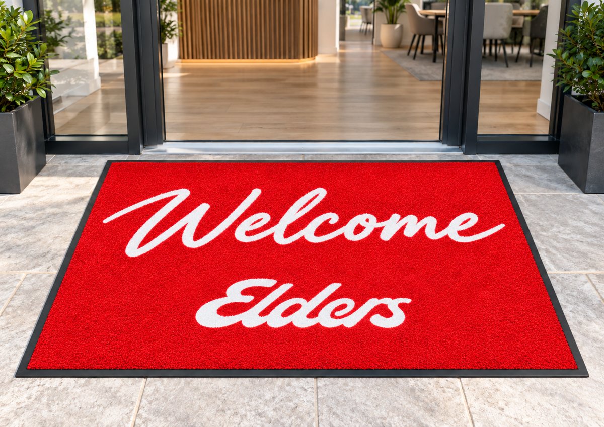 Welcome Elders logo mat at an office entrance