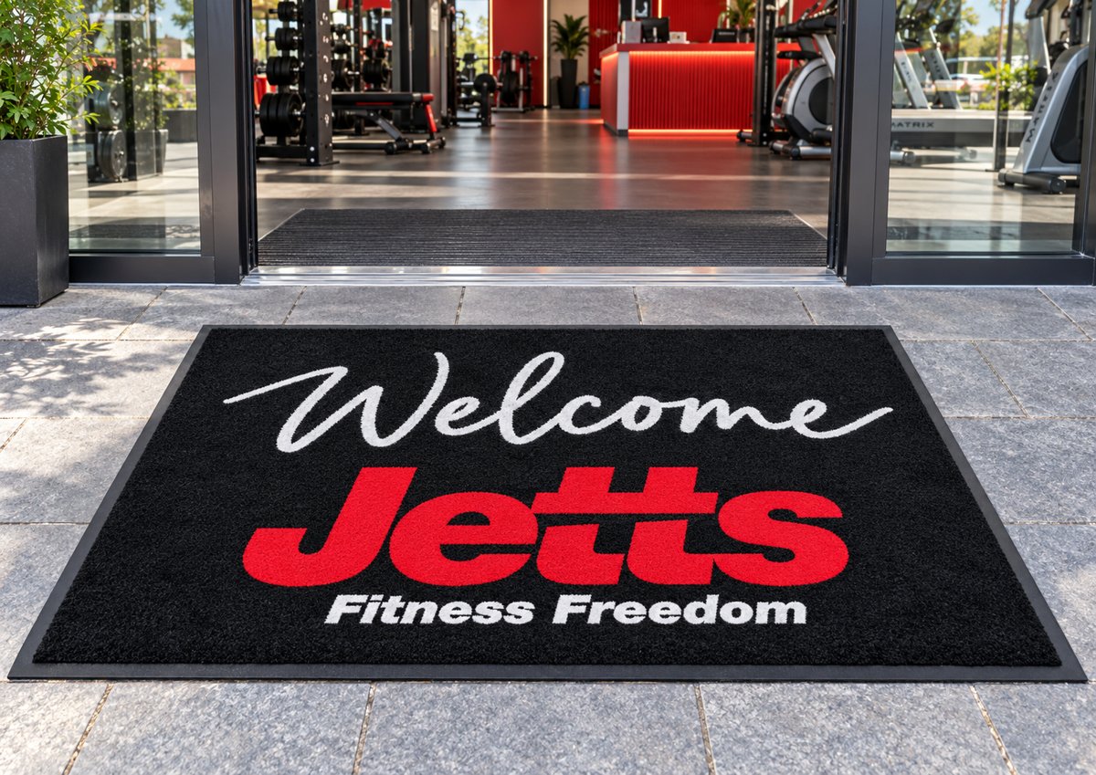 Welcome Jetts custom logo mat at a gym entrance