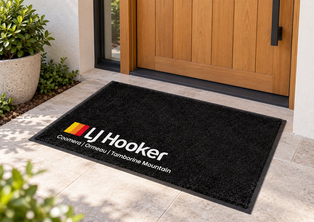 Black logo mat with the LJ Hooker logo and office names in the corner
