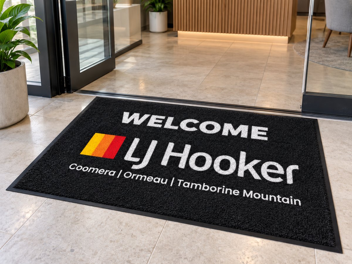 Welcome LJ Hooker custom logo mat at an office entrance