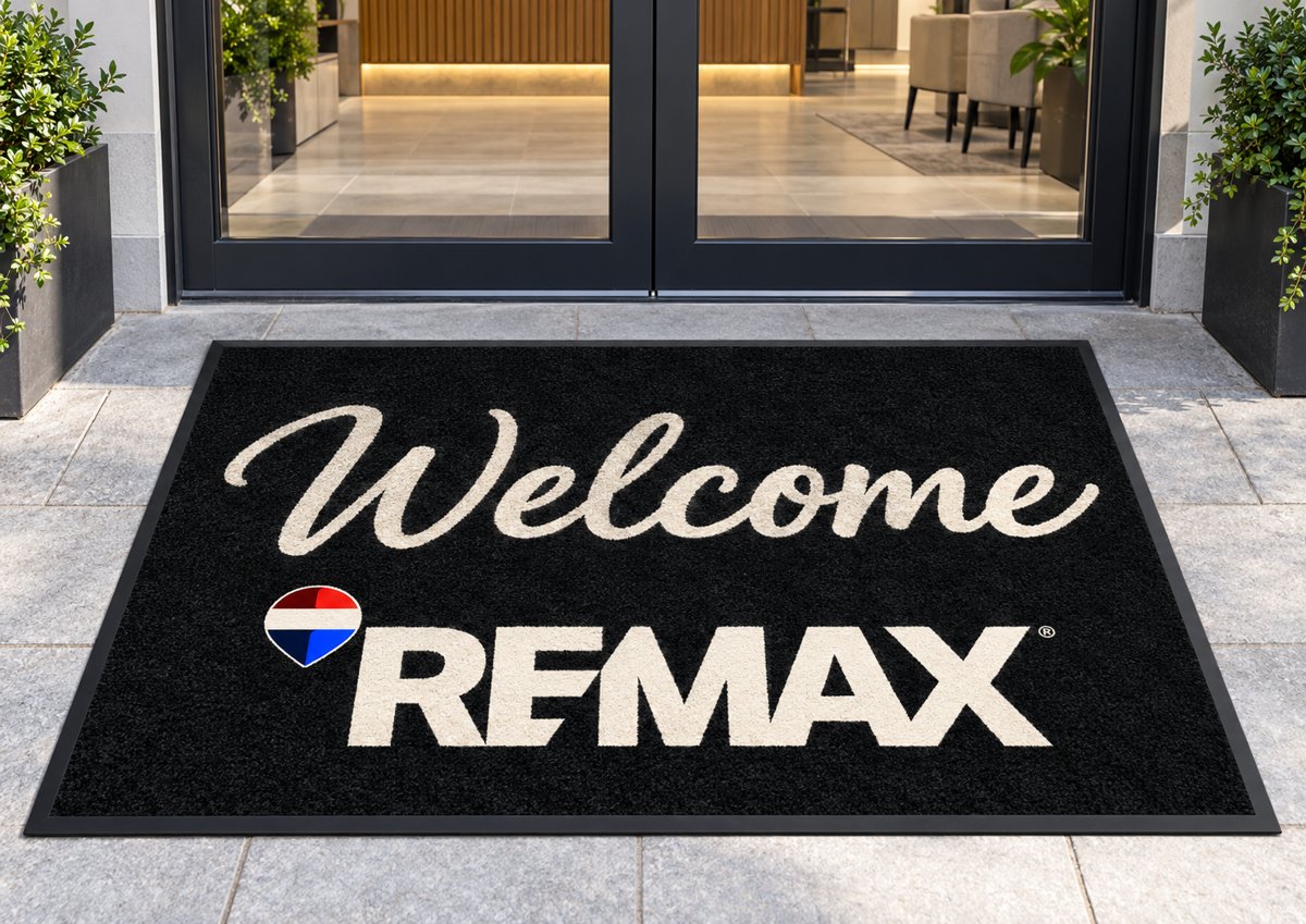 Welcome RE/MAX logo mat at an office entrance