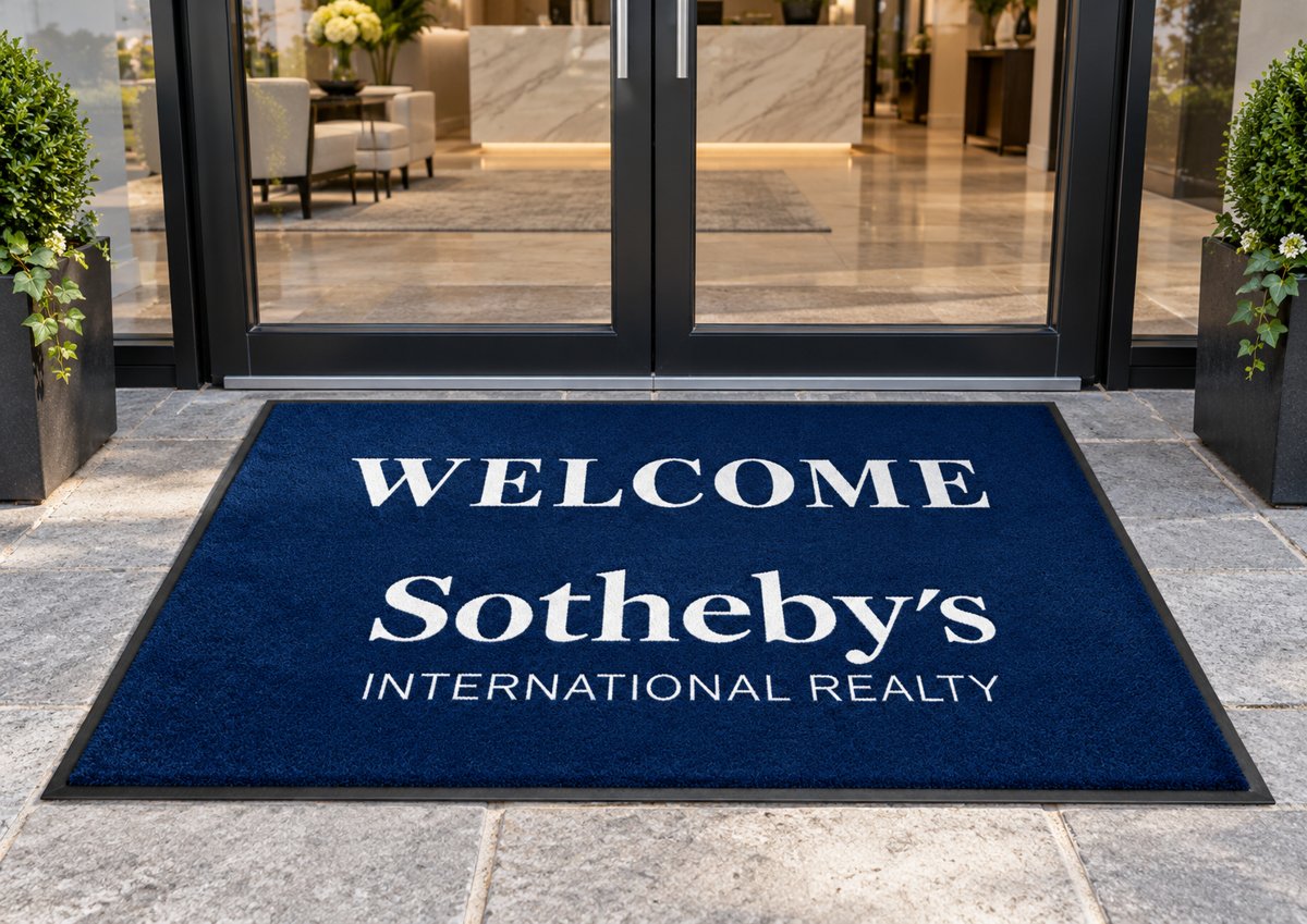 Welcome Sotheby's International Realty custom logo mat at an office entrance