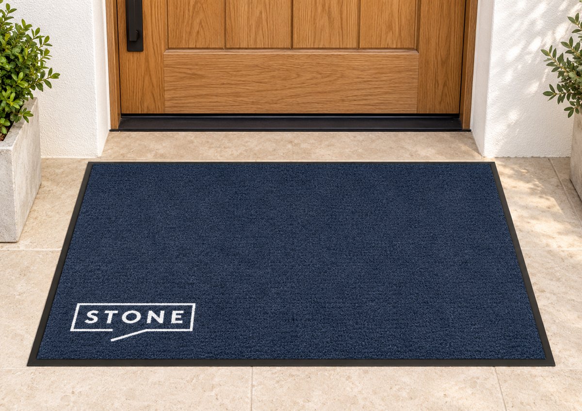 Navy logo mat with the Stone logo in the corner